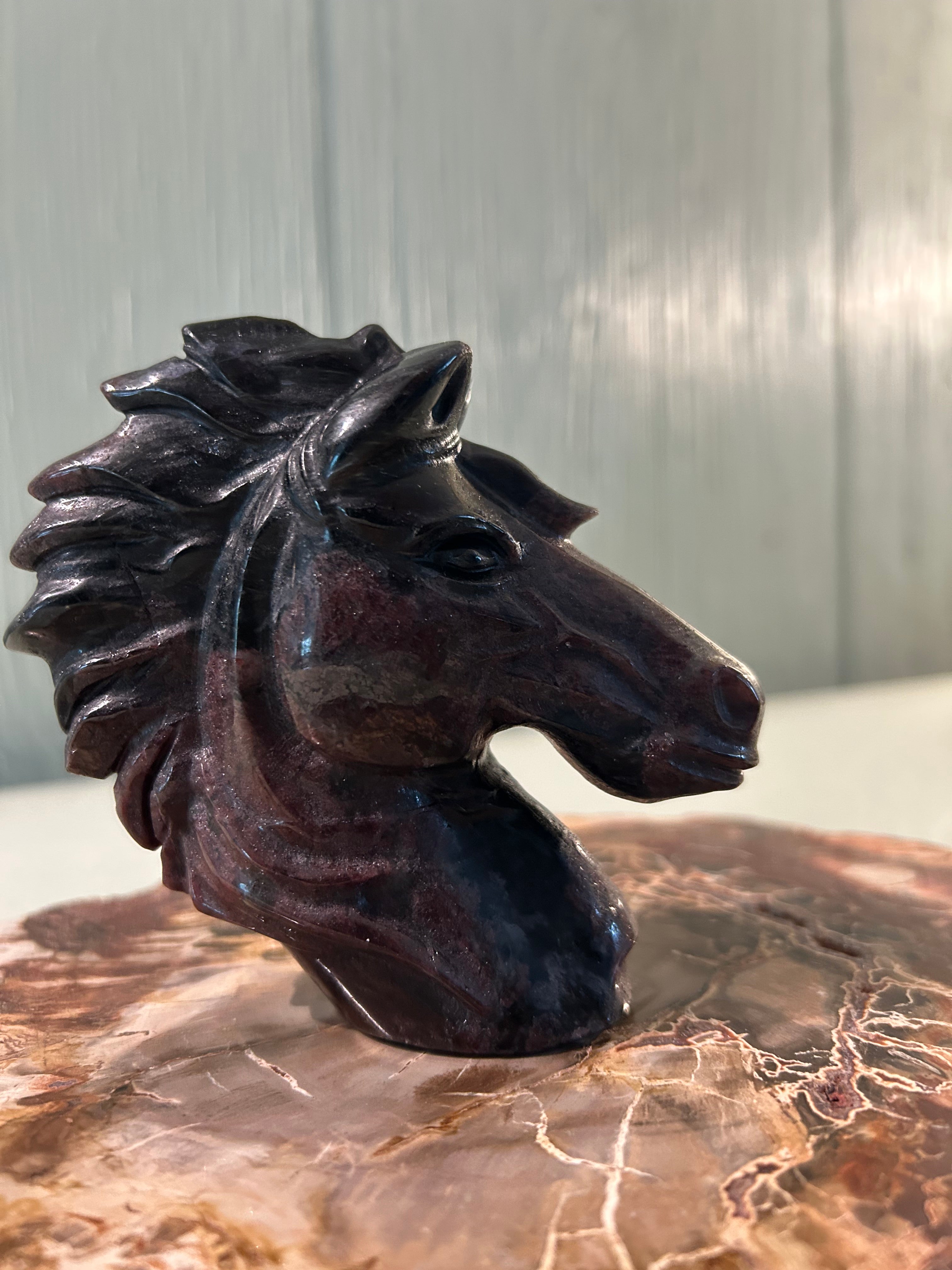 Carved garnet horse head